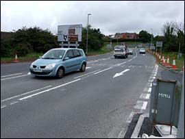 Junction re-engineering across a cycleroute - a disaster for cyclists.