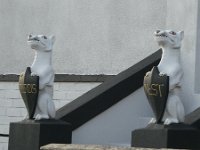 statue dogs birds nest